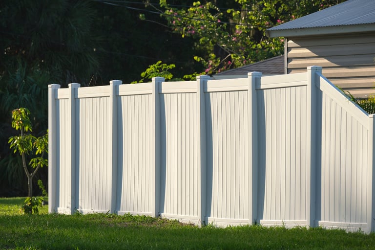 White vinyl fence being professionally cleaned