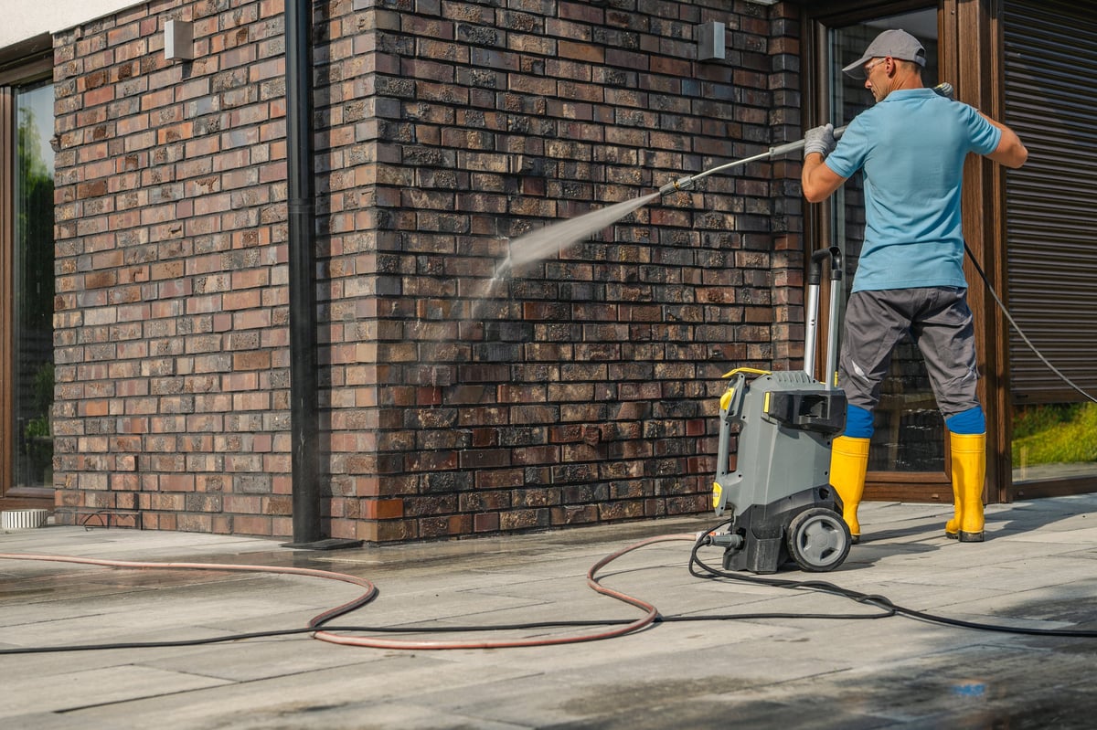 Professional pressure washing commercial building exterior