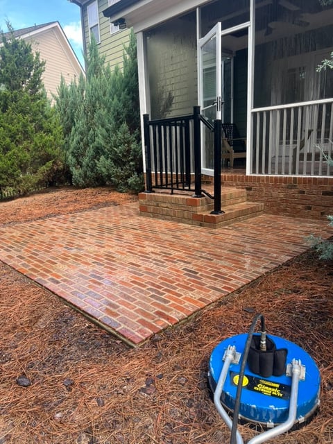 Red brick paver patio in Wake Forest NC freshly cleaned with a professional surface cleaner