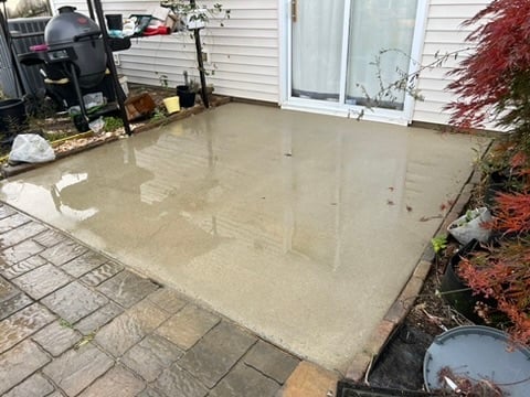 Wet exposed aggregate patio after professional cleaning in Wake Forest NC