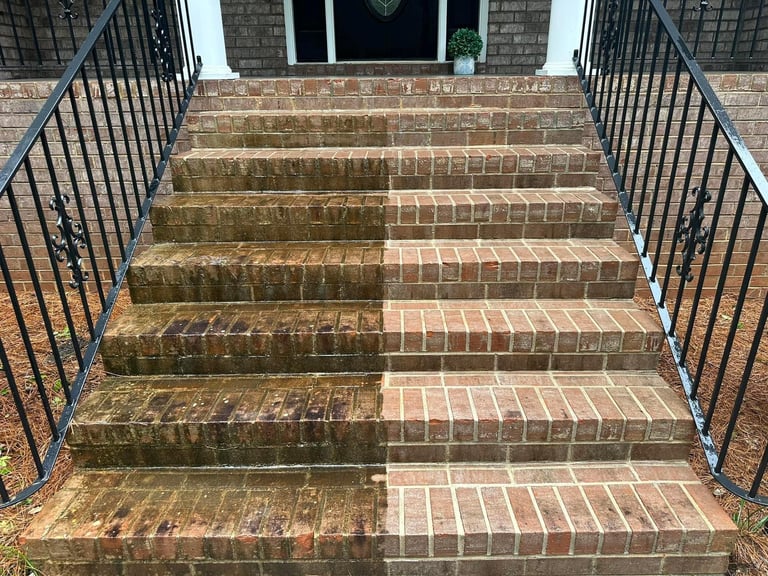 Half cleaned brick staircase showing before and after in one photo, Wake Forest NC